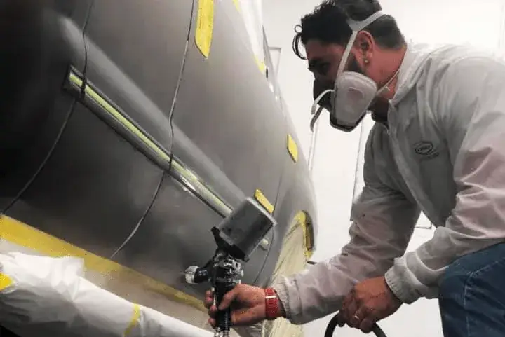 A freshly refinished vehicle panel with a flawless, color-matched paint finish in the Full Tilt spray booth